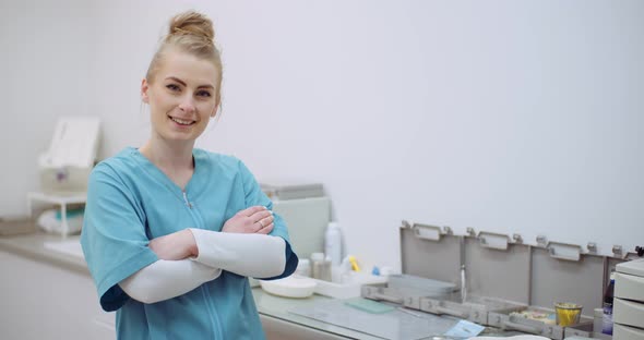 Portrait of Positive Female Doctor at Clinic