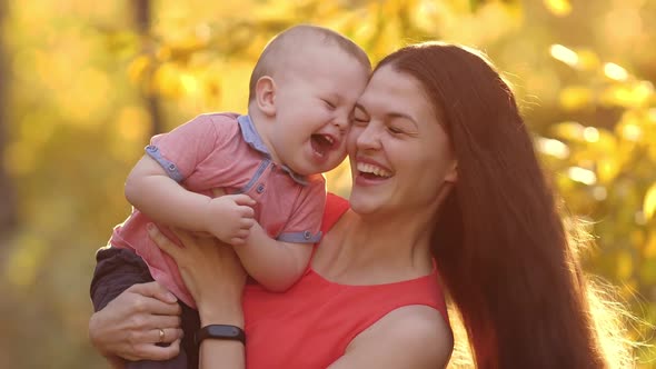 Happy Mother Play with Her Son