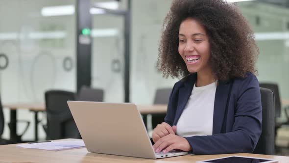 Young African Businesswoman Talking During Video Chat on Laptop