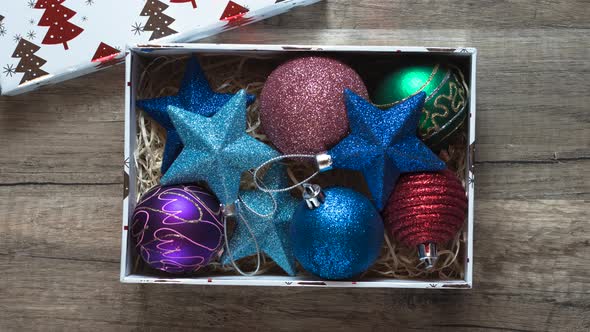 Stop motion with Christmas gift box of decorations - stock video.