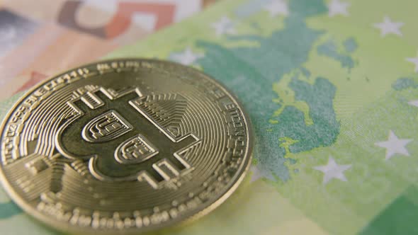 Bitcoin Coins Lie on Euro Banknotes