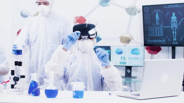 Female Scientist with Virtual Reality Headset in Modern Chemistry Laboratory