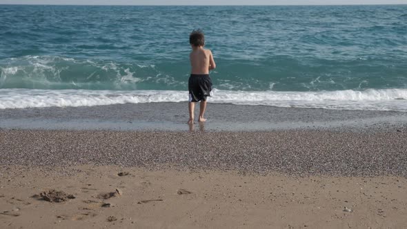 Little Boy Running to Sea