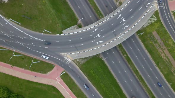 Multilevel Road Junction. Flight Over City Roads. Public Transport Is Visible.