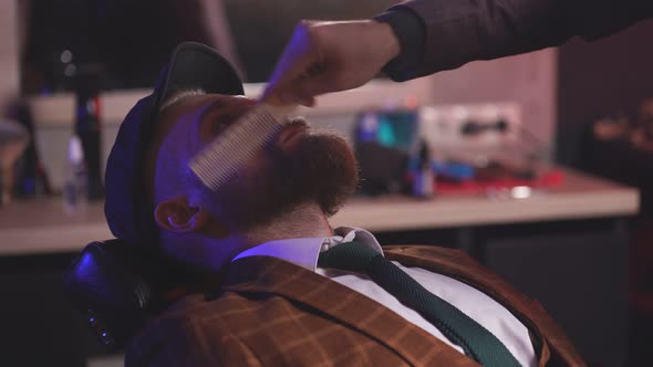 Barber Preparing Client for Cutting Beard