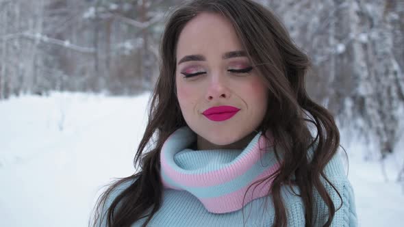 Beautiful Woman in Snowy Countryside