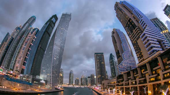 View of Dubai Marina Towers and Canal in Dubai Day to Night Timelapse