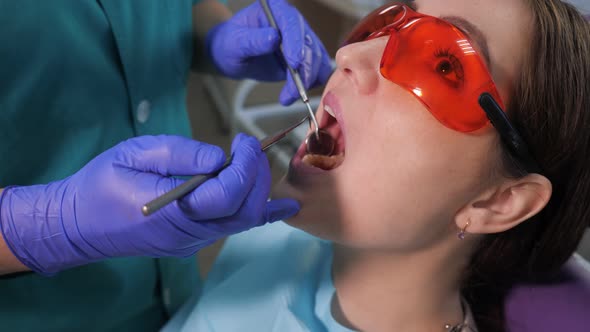 Young Woman on Preventive Examination in Dental Chair at the Dentist