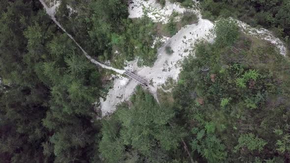 Aerial top view of Sugana Valley, with drone rotating while descending