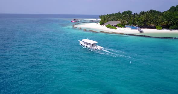 Beautiful above travel shot of a summer white paradise sand beach and aqua blue ocean background in 