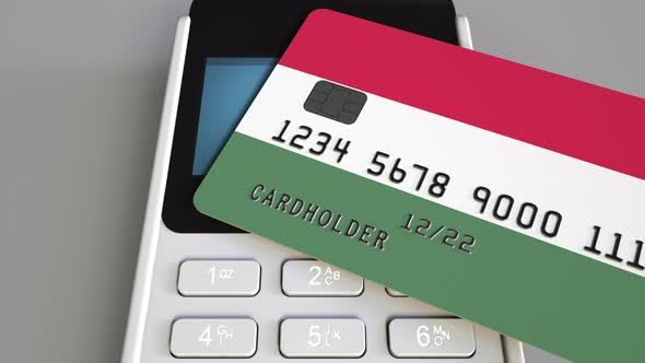 POS Terminal with Credit Card with Flag of Hungary alt