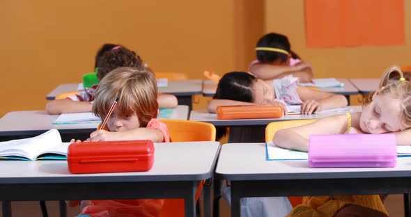 School kids studying in classroom