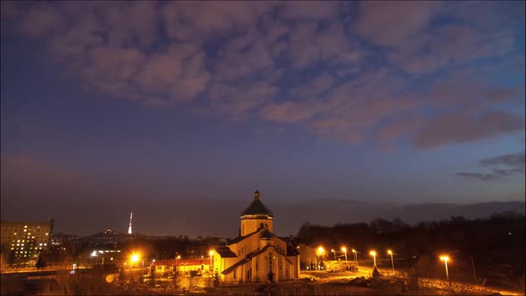 Beautiful time lapse day to night: clouds and stars moving by city sky. 