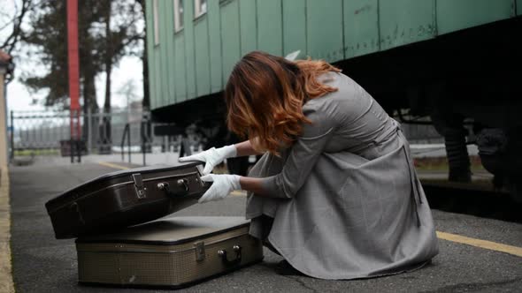 Girl with Two Suitcases