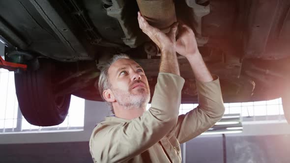 Mechanic servicing a car