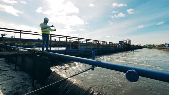 Wastewater Operator Taking Water Samples at a Sewage Cleaning Plant