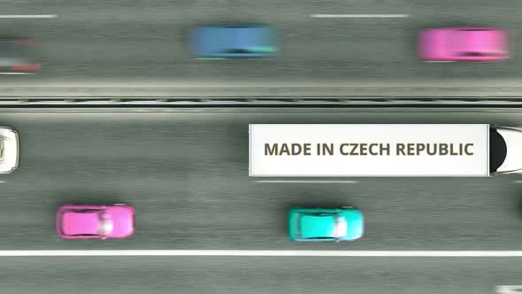 Trucks with MADE IN CZECH REPUBLIC Text Driving Along the Road