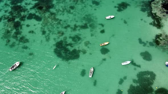 Aerial Top Down View Of Anchored Boats In Clear Water Of Indian Ocean