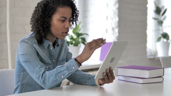 Tense African Girl Reacting to Financial Loss While Using Tablet