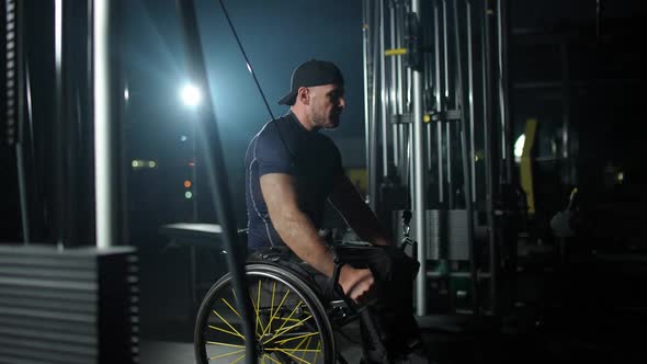 Fortitude Disabled Athlete in Wheelchair Lifting Blocks on Rack Machine Strength Training on Block