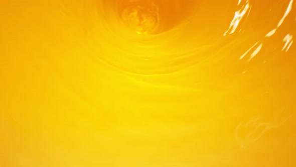 Super Slow Motion Shot of Fresh Orange Juice Wave at 1000 Fps