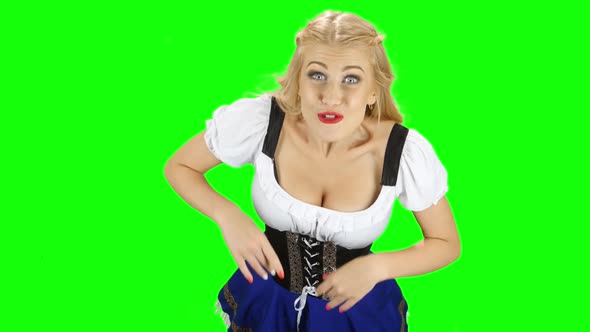 Bavarian Girl Something Really Admires the One in the Room. Green Screen