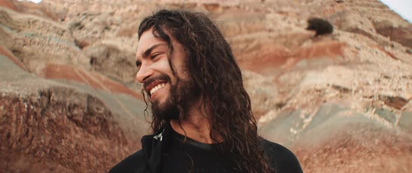 Closeup of two surfers talking and laughing