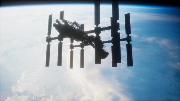 A View of the Earth and a Spaceship. ISS Is Orbiting the Earth alt