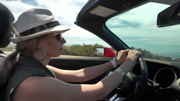 Girl Driving in Convertible Car