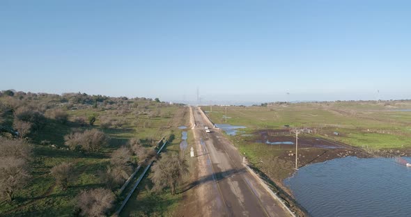 Aerial view of vehicles driving in a grassland, Golan Heights, Israel.