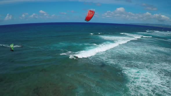 Aerial view of a man kitesurfing in Hawaii