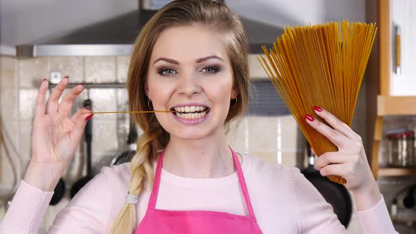 Girl Shows Raw Spaghetti Pasta