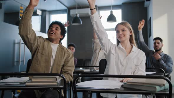 Diverse Group Smart Students Sitting in Classroom at Lesson Carefully Listening to Teacher Lecture