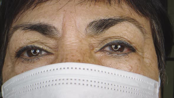 Closeup of Older Woman's Face While Wearing Protective Face Mask