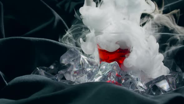 Red Alcohol Cocktail with Dry Ice