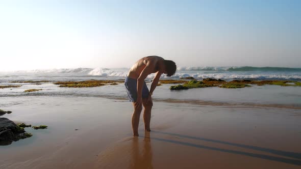 Handsome Sportsman Meditates in Yoga Pose Extreme Slow
