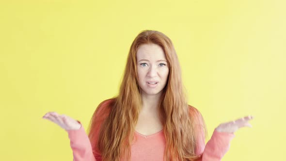 Dissatisfied female looks into camera she does not like something,