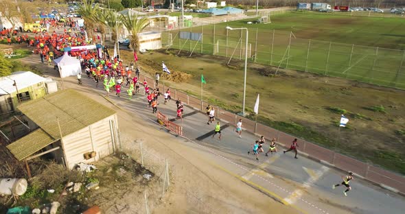 Aerial View of people at the starting line of the city marathon.