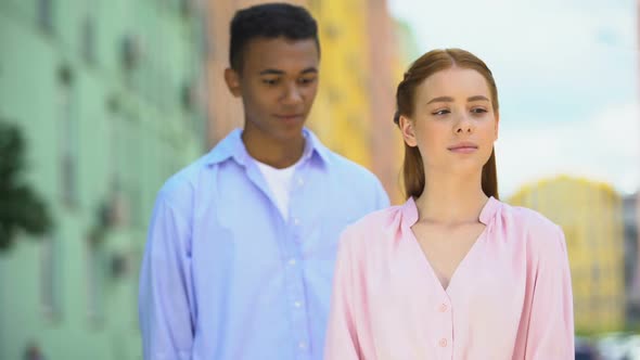 Teen Guy Quietly Coming From Behind and Touching Girlfriends Shoulder, Surprise