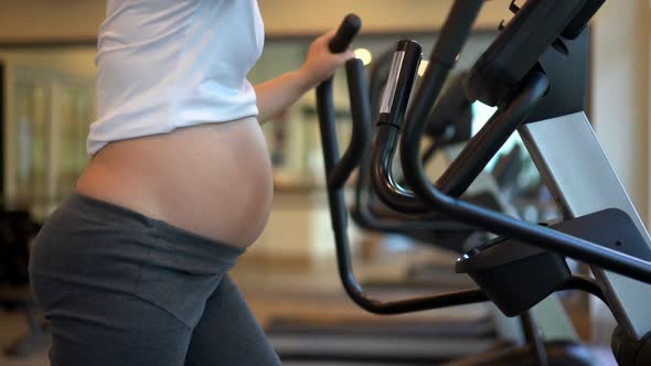Active Pregnant Woman Exercise in Fitness Center