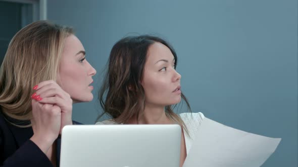 Two Female Managing Directors Discussing Ideas of Project While Sitting on Conference in Office Hall