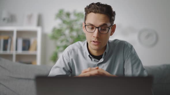 Man Talking During Video Call on Laptop