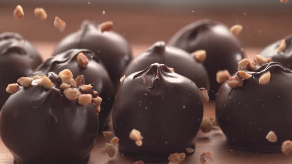 Nuts falling onto chocolate truffles in super slow motion.  Shot on Phantom Flex 4K high speed camer