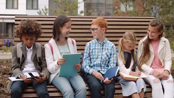 Group of Pupils Sitting on Bench