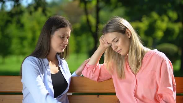 Woman Secretly Rejoicing Grief of Her Friend Pretending to Sympathize With Her