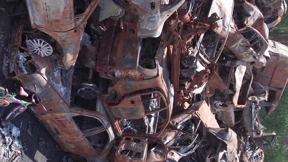 Vertical Video Irpin Bucha District  Destroyed Cars During the War in Ukraine