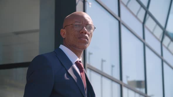 Pensive Elegant African American Businessman Looking at Camera Close Up