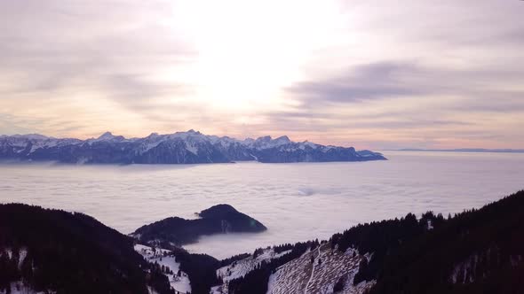 Aerial hyperlapse of "sea of fog" over Lake Léman area, Vaud - Switzerland. Fog swirling and moving