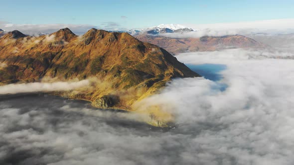 Aerial view of Unalaska Bay with fog on Unalaska island, Alaska, United States.