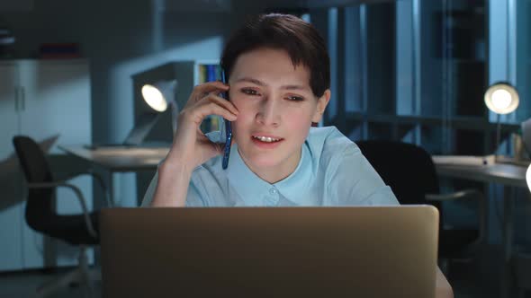 Close Up of Female Consultant Advise Client on Phone Working Late